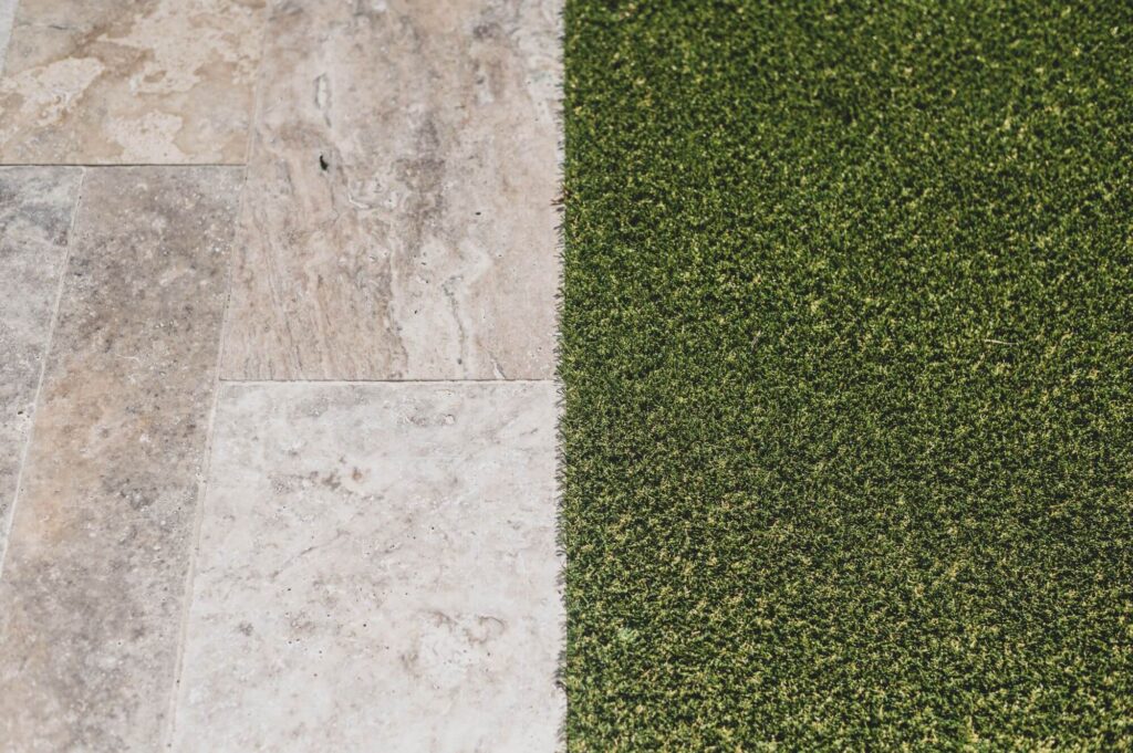 This photo represents a concrete flooring with artificial turf. Looking at this, you might wonder "How long does artificial turf last?", but in one of our blogs, we answer that!