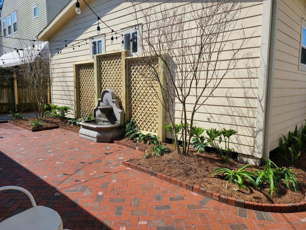 An exterior view of the Duxstand residence fountain, an outdoor landscape design in New Orleans.