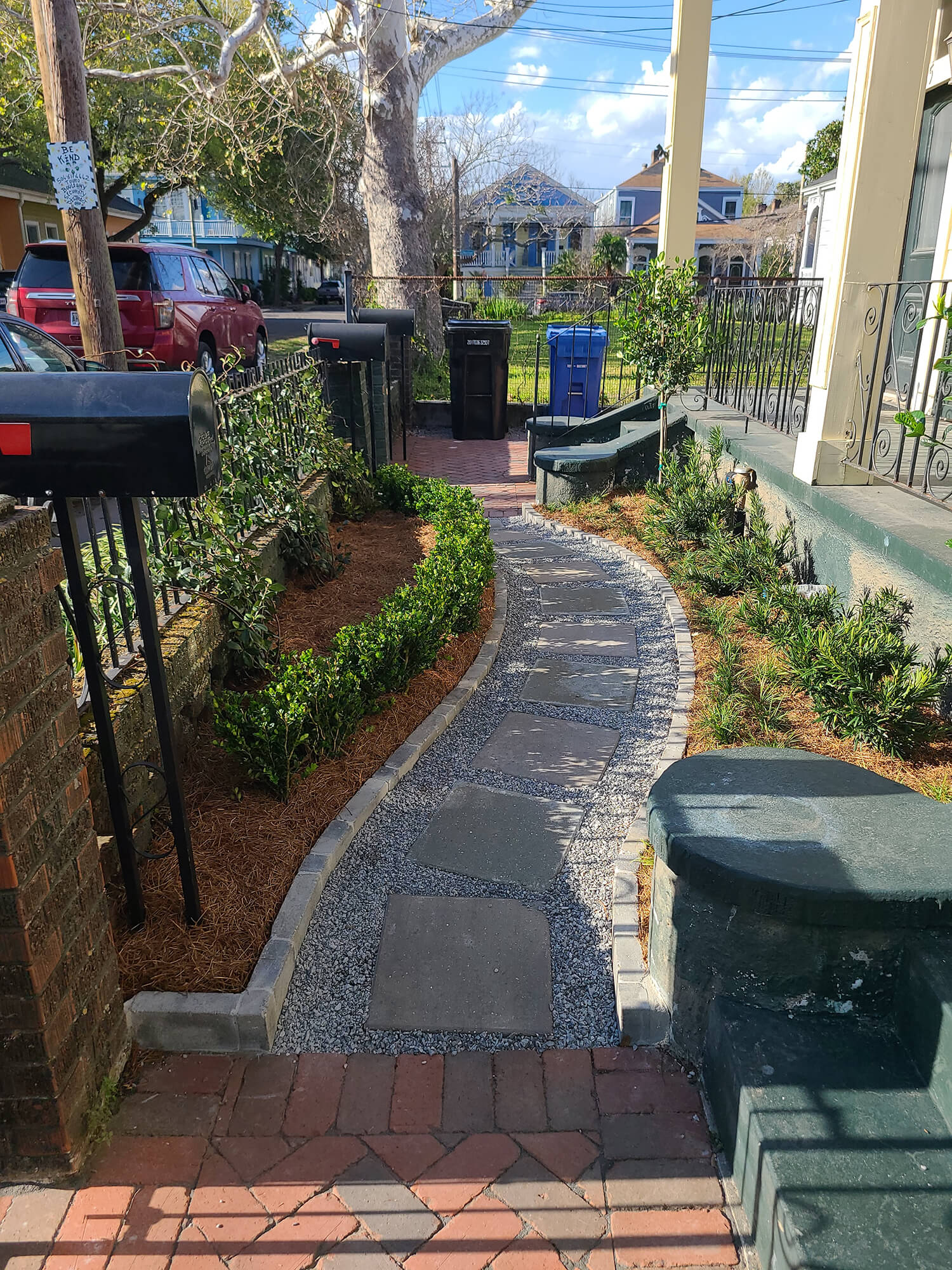 An exterior view of the Duxstand residence pathway, an outdoor landscape design in New Orleans.
